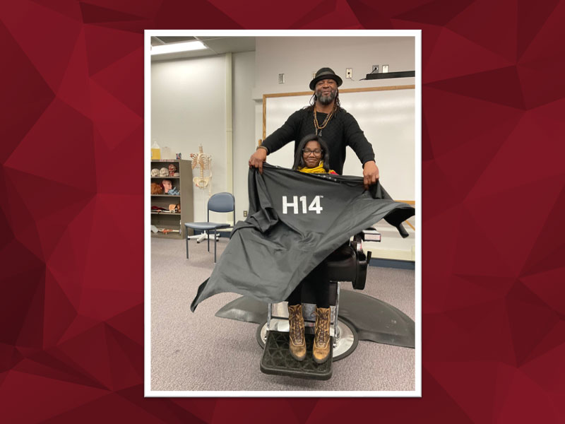 Renowned Celebrity Barber Terrance Manning prepares to demonstrate the latest styling techniques on a local salon professional during his visit to CCAC.