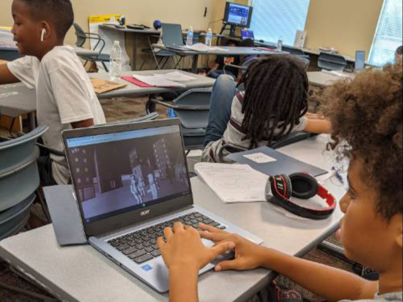 STEM students working on the computer