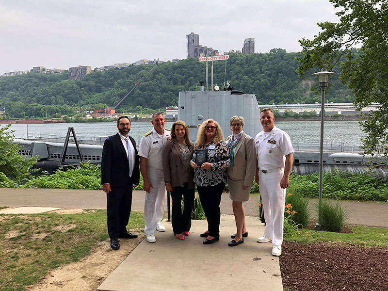 Pictured left to right: Mike Thompkins, Asst. Dean of Business and Technology; Rear Admiral Scott Pappano, Program Executive Officer for Strategic Submarines; Dr. Sara Conroy, Dean of Business and Technology; Dr. Debra Roach, Vice President for Workforce Development; Jeannine Westlock, Account Executive for Workforce Development; CMDCM Josh Sturgill, Senior Enlisted Advisor to Team Submarines.