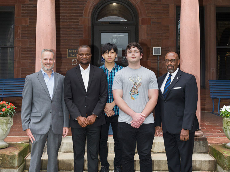 Pictured left to right: CCAC Endowed Professor for Technical Curriculum Michael Rinsem; CCAC students Peter Itodo, Thu Htun and Norman Bernardi; and CCAC President Dr. Quintin Bullock. 
