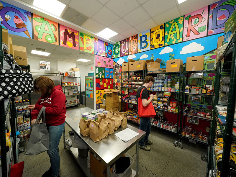 Students browse the shelves at one of CCAC’s Campus Cupboards.