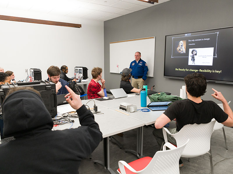 NASA Astronaut Mike Fincke explains the benefits of space careers to mechatronics and science students during a visit to CCAC main campus.